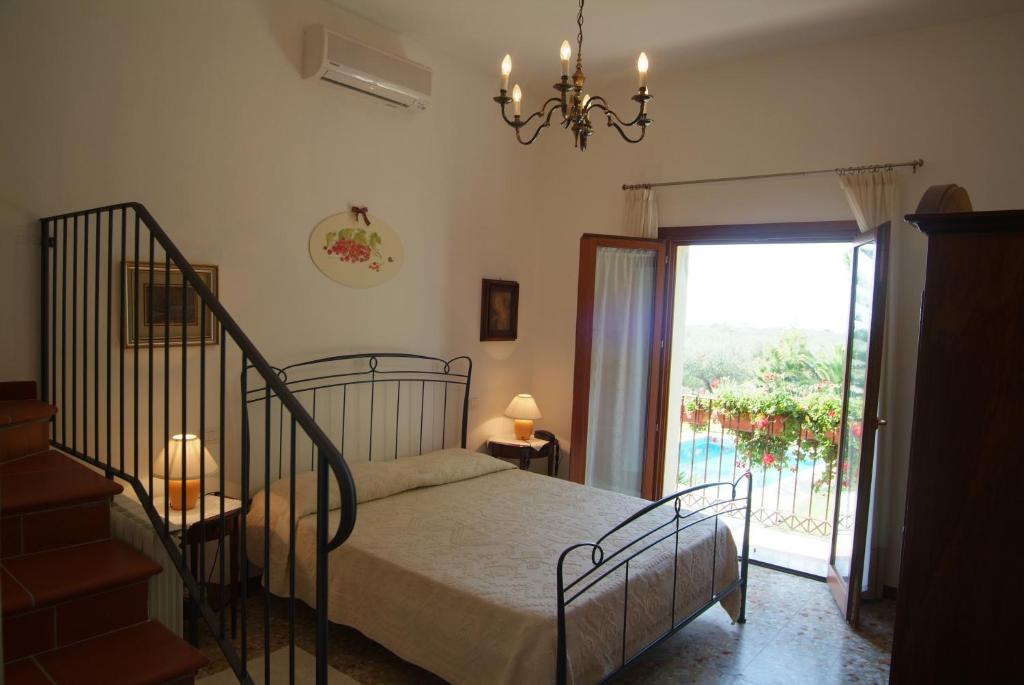 Postel nebo postele na pokoji v ubytování Country Hotel Vessus