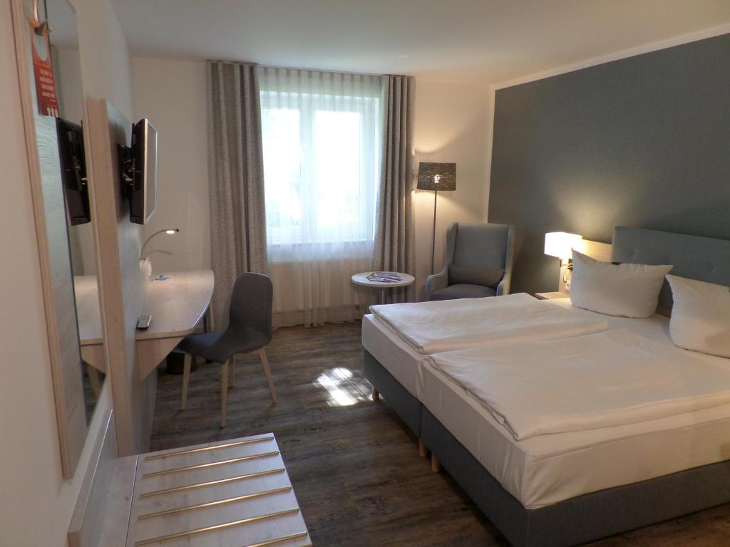 Postel nebo postele na pokoji v ubytování C-YOU Hotel Chemnitz