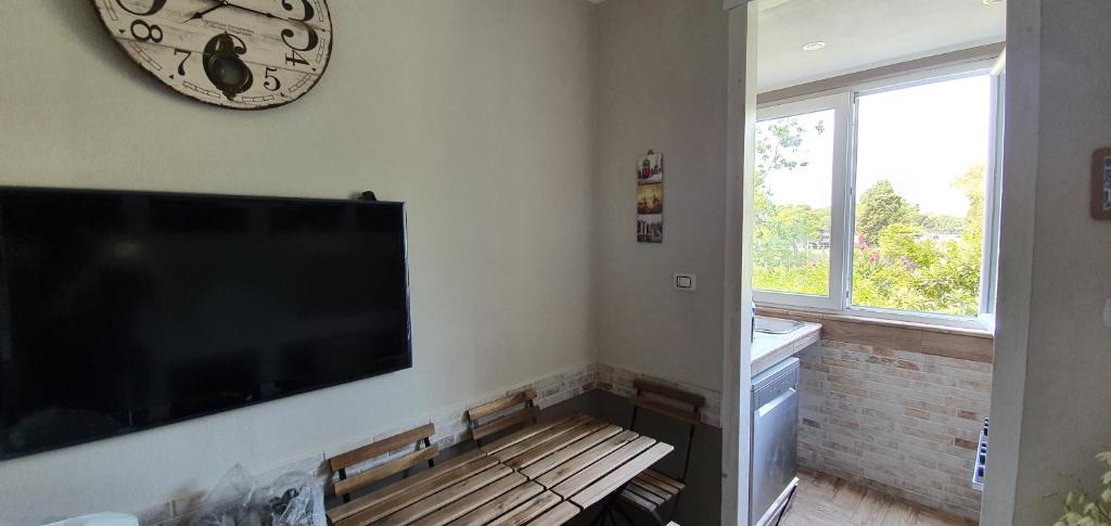 Telewizja i/lub zestaw kina domowego w obiekcie Guesthouse Luisella
