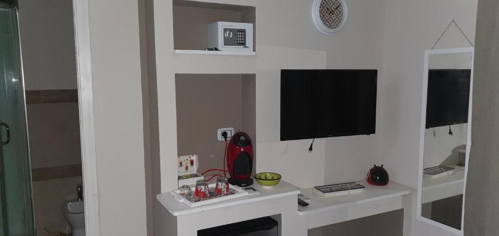 Telewizja i/lub zestaw kina domowego w obiekcie Guesthouse Luisella