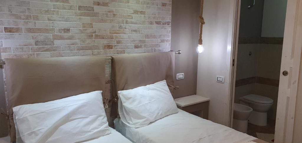 Łóżko lub łóżka w pokoju w obiekcie Guesthouse Luisella