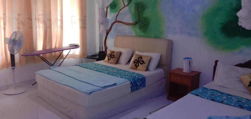 מיטה או מיטות בחדר ב-White Arcadia cottage