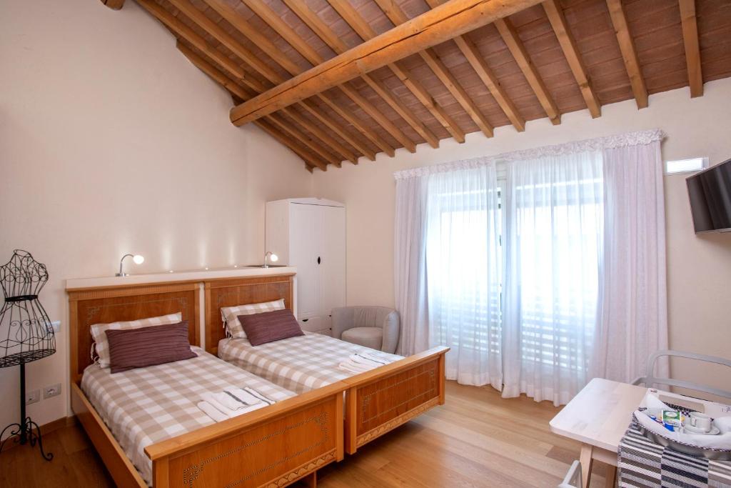 Giường trong phòng chung tại Podere Castagne