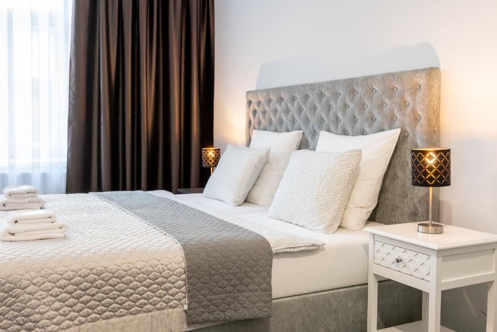 Postel nebo postele na pokoji v ubytování Penzion Apartmány Hradební