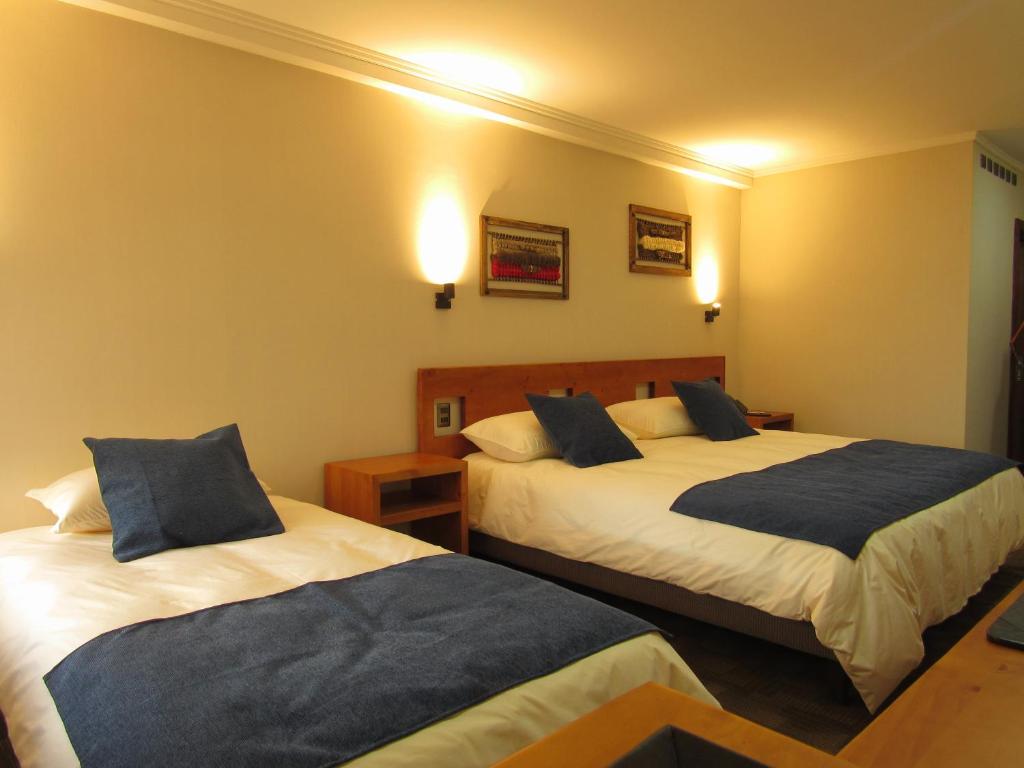 Cama o camas de una habitación en Hotel Pucón Indómito