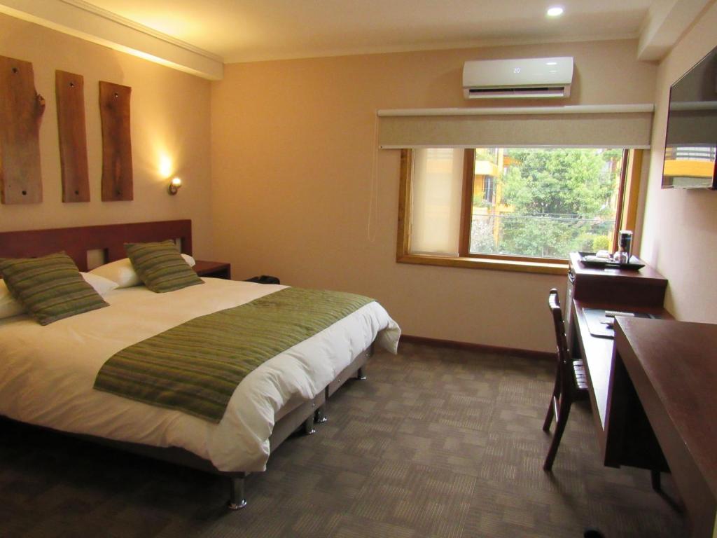 Cama o camas de una habitación en Hotel Pucón Indómito