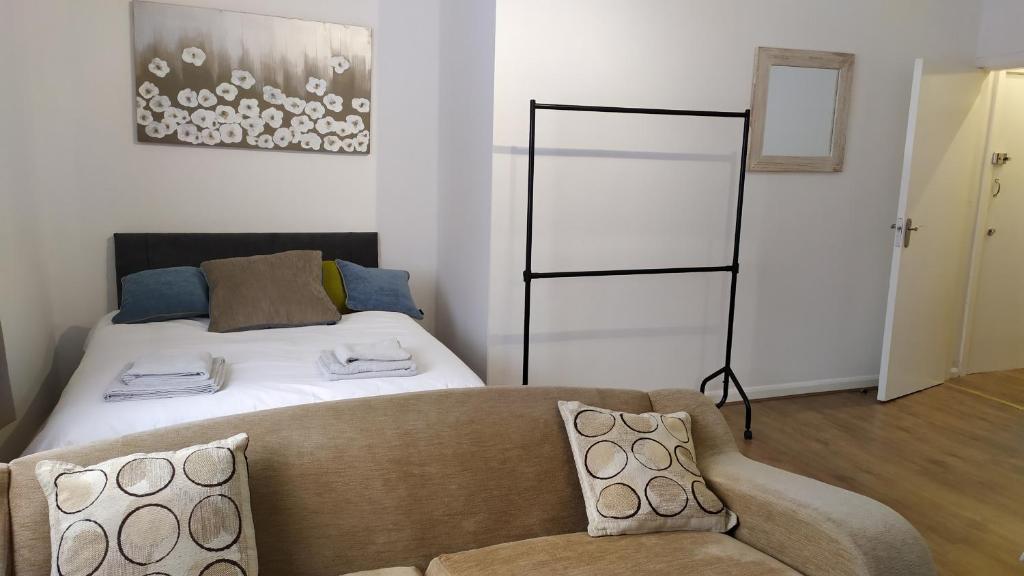 מיטה או מיטות בחדר ב-Townsend Rooms
