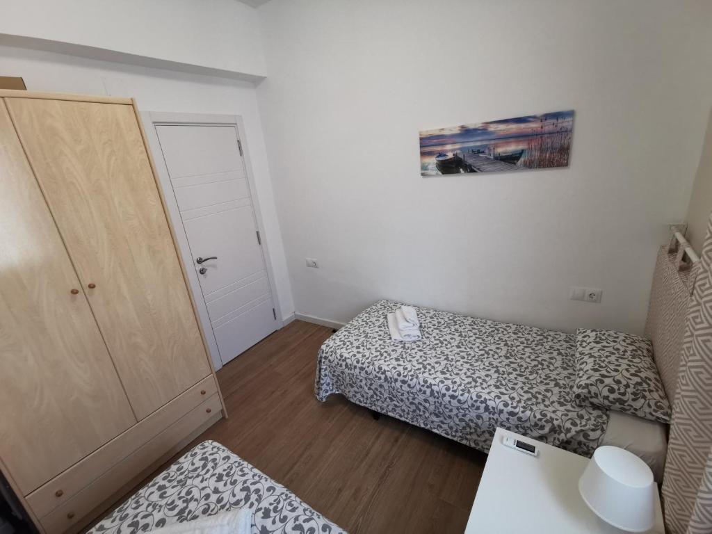 Posteľ alebo postele v izbe v ubytovaní GENUAR APARTMENTS 3 Bedroom close to beach