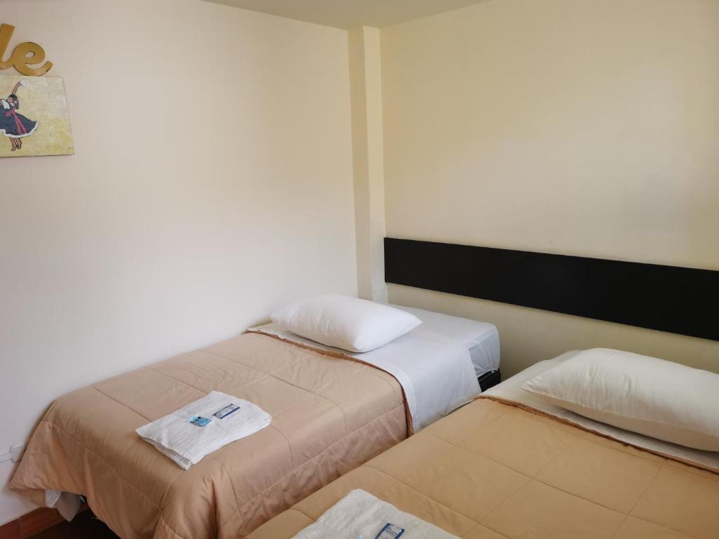 Postel nebo postele na pokoji v ubytování Residencial Mamamia