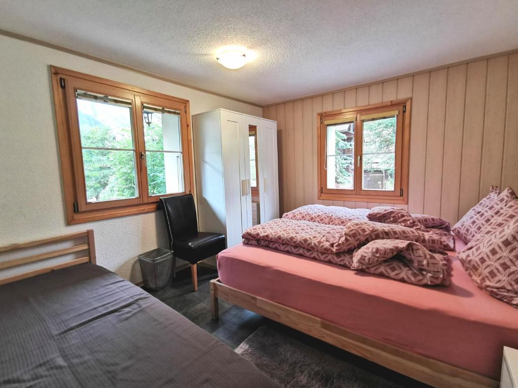 Postel nebo postele na pokoji v ubytování Apartments Chalet Tatyana