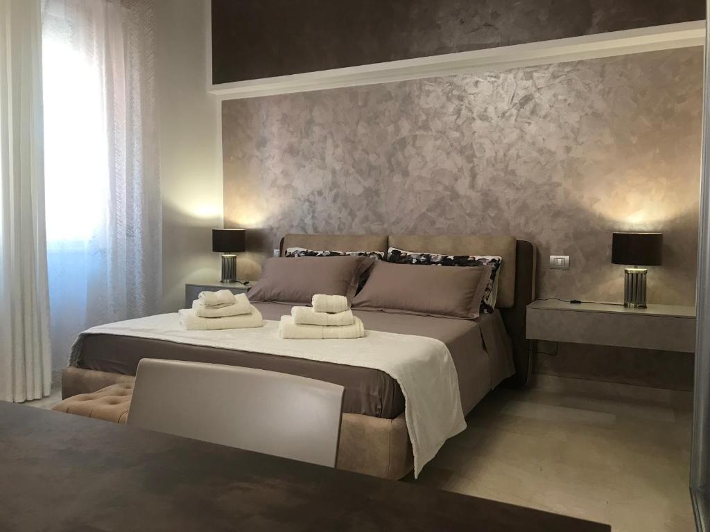Postel nebo postele na pokoji v ubytování via roma 12 VERONA