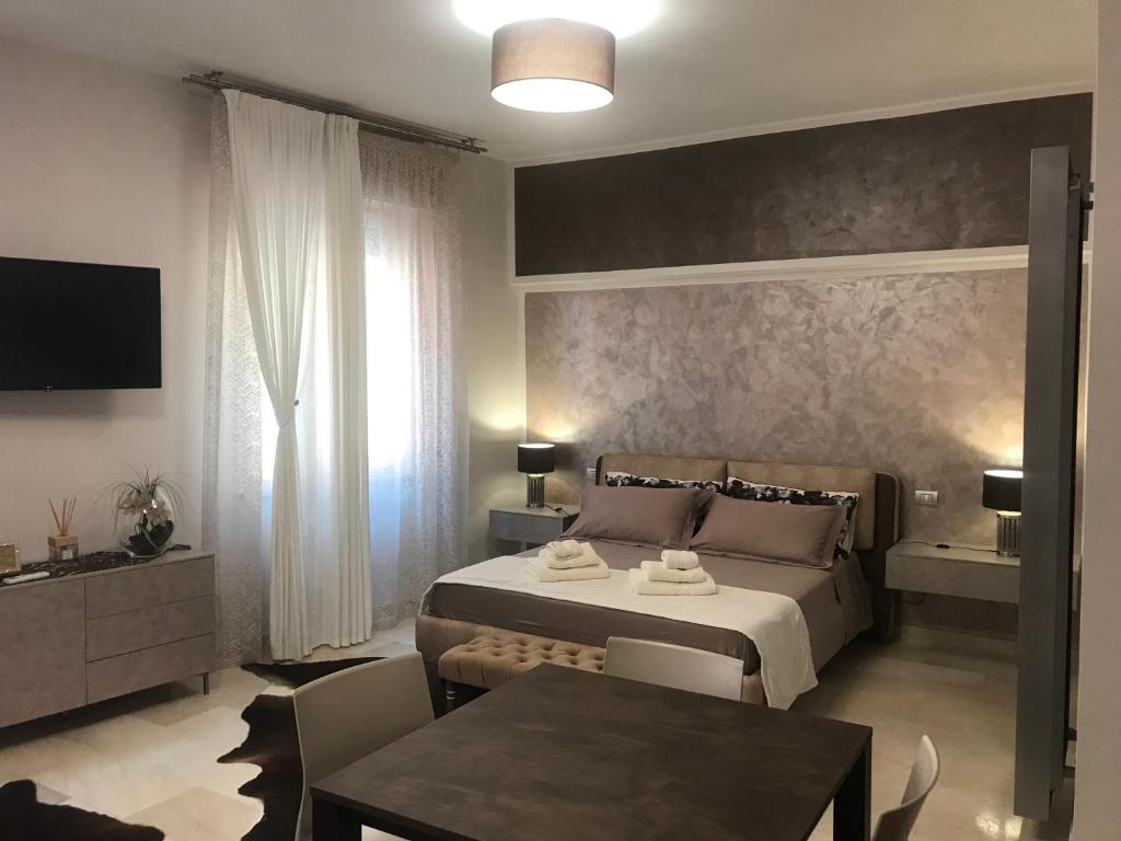 Postel nebo postele na pokoji v ubytování via roma 12 VERONA