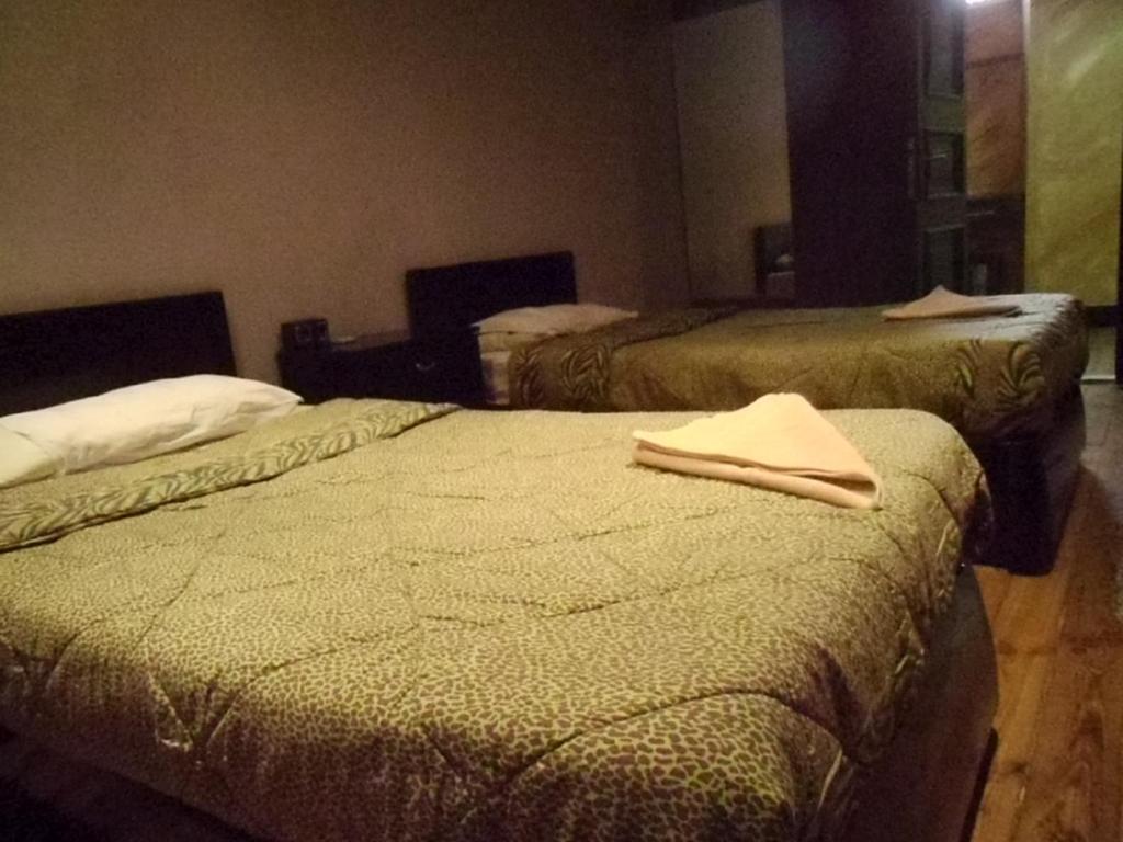 Una cama o camas en una habitación de Freedom Hostel