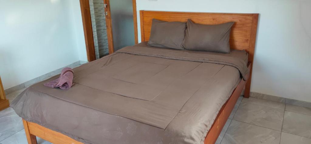 Postel nebo postele na pokoji v ubytování Medewi Beach Inn