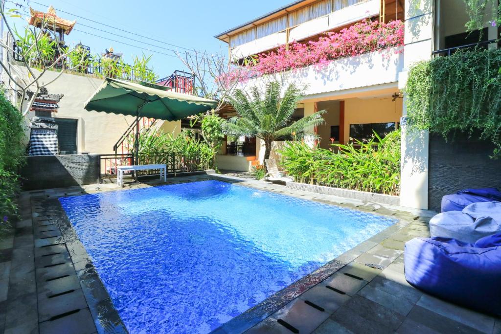 a swimming pool in the middle of a house at Rantun's Place in Nusa Dua