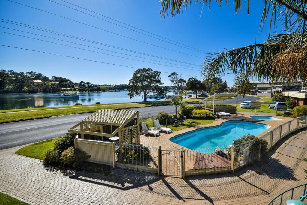 an aerial view of a house with a swimming pool at Emmanuel Holiday Apartment in Lakes Entrance