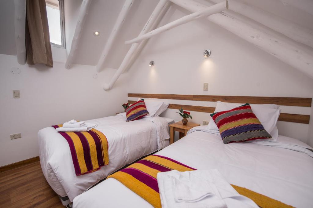 Postel nebo postele na pokoji v ubytování Casa Cavassa Centro Histórico Cusco