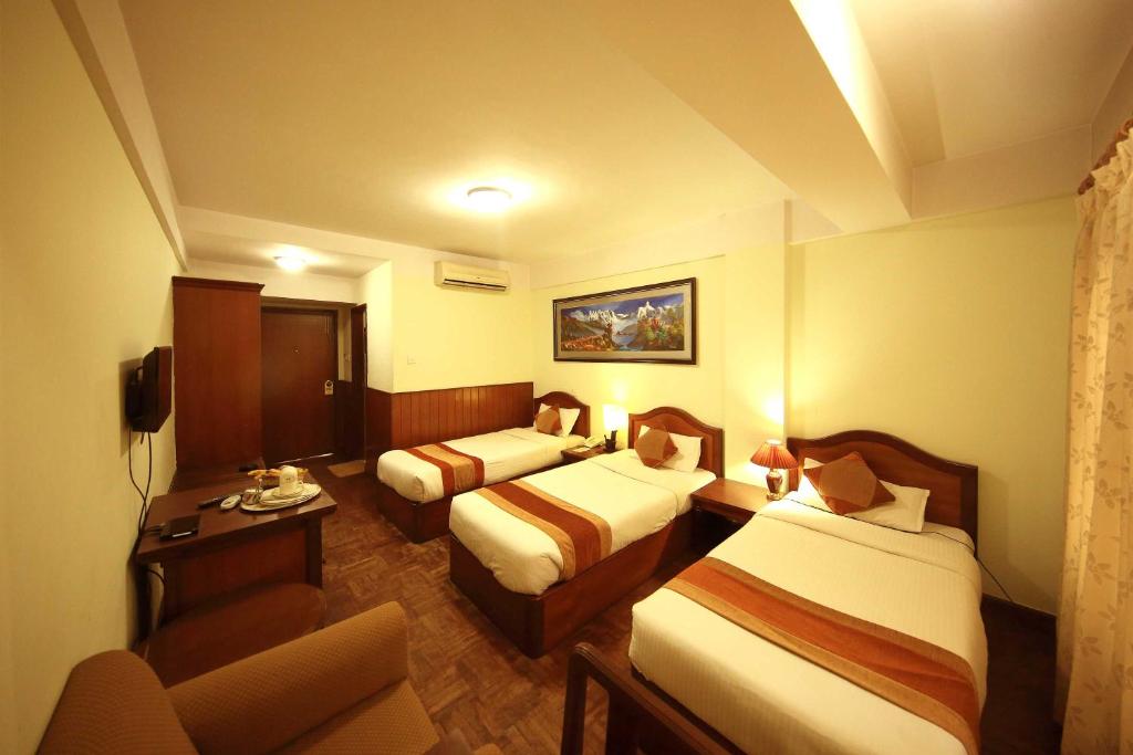 Postel nebo postele na pokoji v ubytování Samsara Boutique Hotel