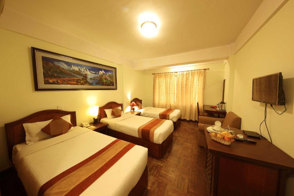 Postel nebo postele na pokoji v ubytování Samsara Boutique Hotel