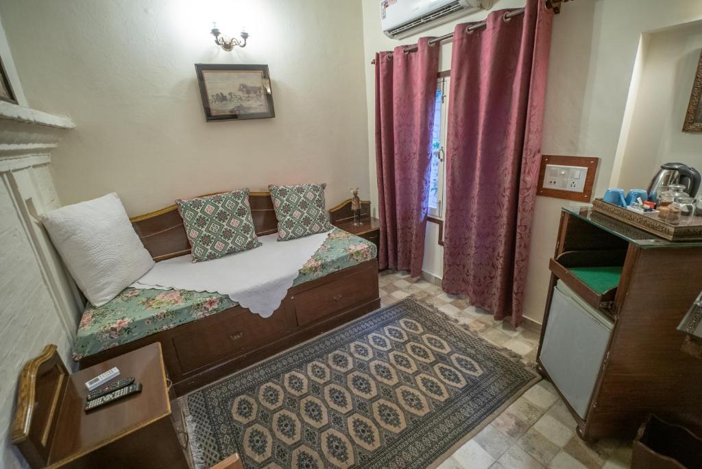 Postel nebo postele na pokoji v ubytování Ranjit's Svaasa Amritsar
