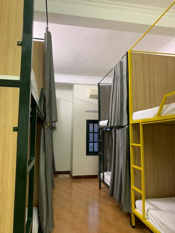 a room with a bunch of bunk beds at Be's Home & Tours in Ha Giang