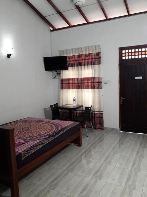 Postel nebo postele na pokoji v ubytování White Wall Hotel