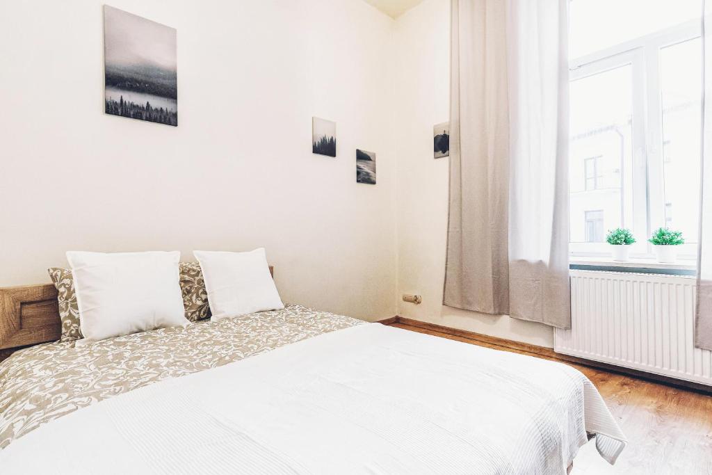 Posteľ alebo postele v izbe v ubytovaní Apartament Żółty Narutowicza 11