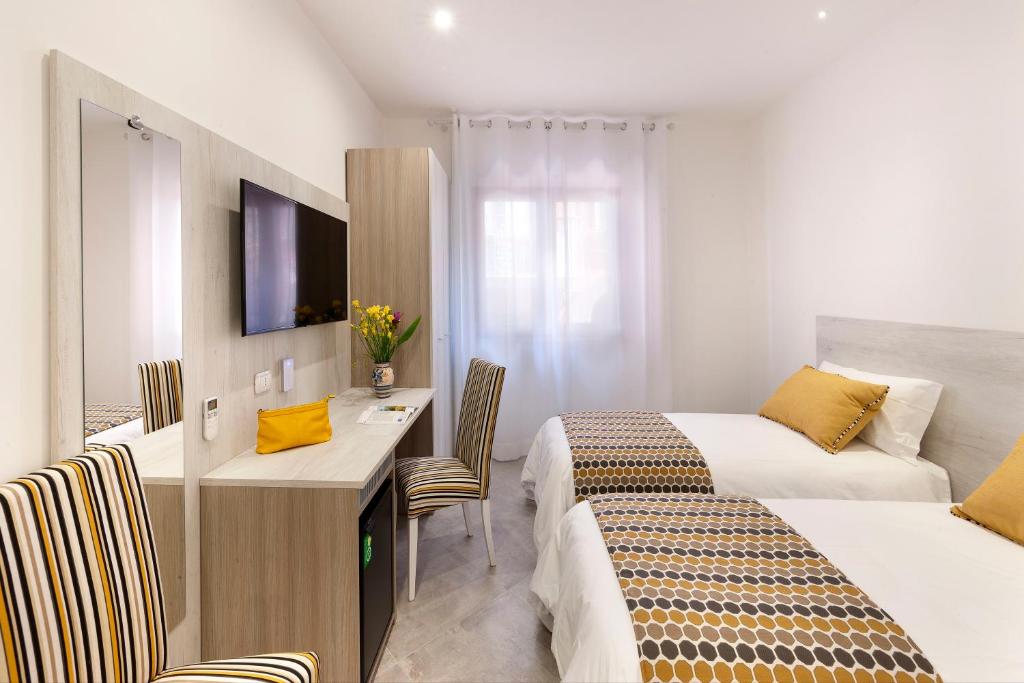 Postel nebo postele na pokoji v ubytování Delle Rose Suites