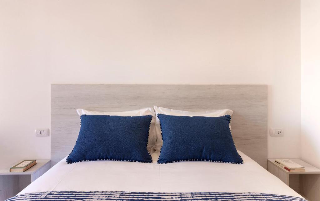 Postel nebo postele na pokoji v ubytování Delle Rose Suites