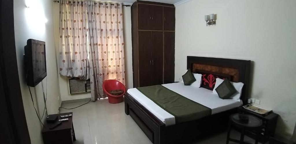 Postel nebo postele na pokoji v ubytování Hotel Home Stay Dwarka