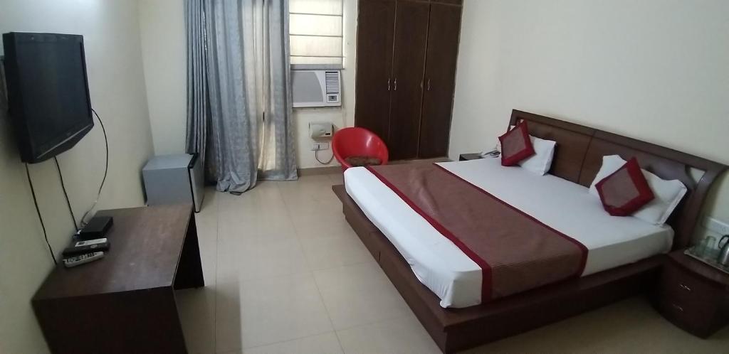 Postel nebo postele na pokoji v ubytování Hotel Home Stay Dwarka