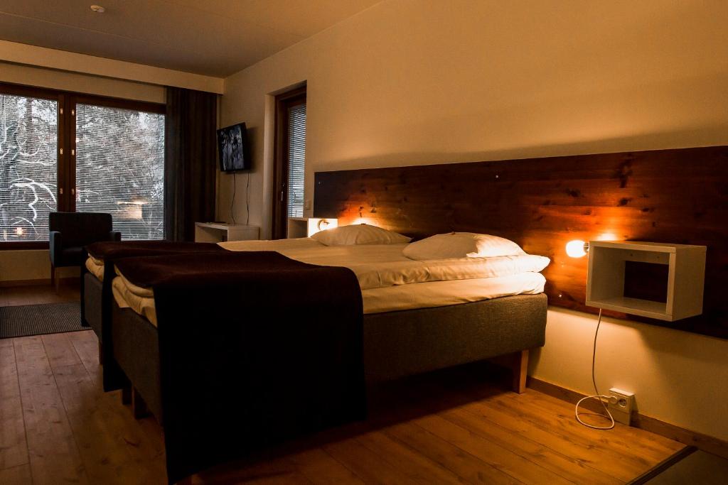 Кровать или кровати в номере Hotel Arctic Zone
