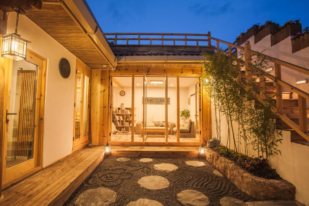 a hallway of a house with a staircase at Eden Court in Lijiang