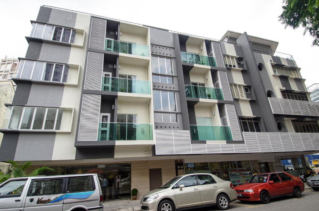 a building with cars parked in front of it at 12FLY Hotel Kuala Lumpur in Kuala Lumpur