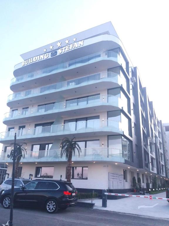 a car parked in front of a building at Seatime Studio in primul rând la mare in Mamaia Sat/Năvodari