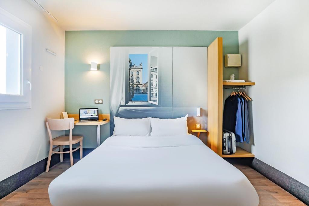Postel nebo postele na pokoji v ubytování B&B HOTEL Nancy Frouard
