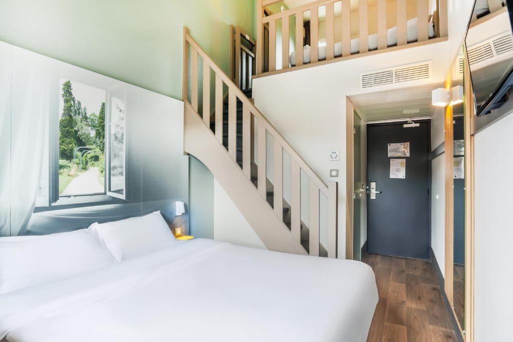 Postel nebo postele na pokoji v ubytování B&B HOTEL Nancy Frouard