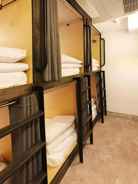 a group of bunk beds in a room at Seoul Cube Itaewon in Seoul