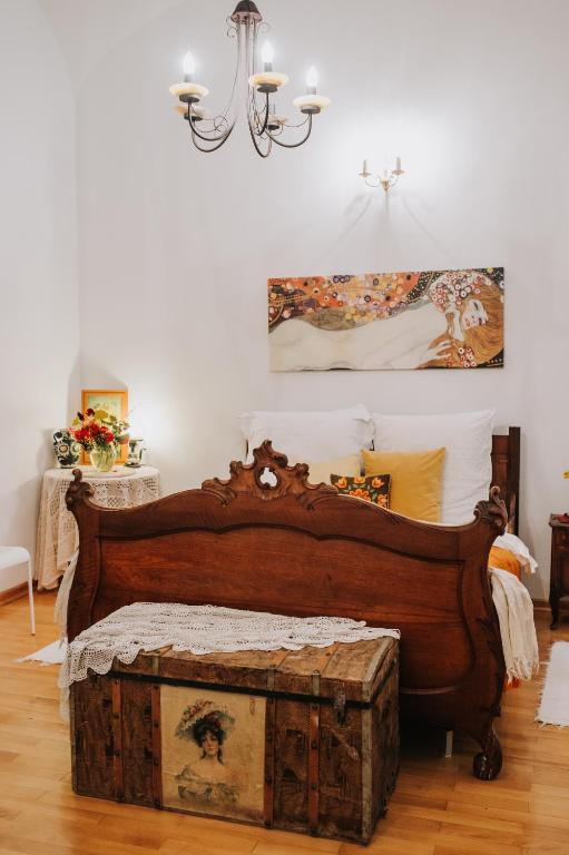 a bedroom with a bed with a trunk in it at Art Gallery Residence in Braşov