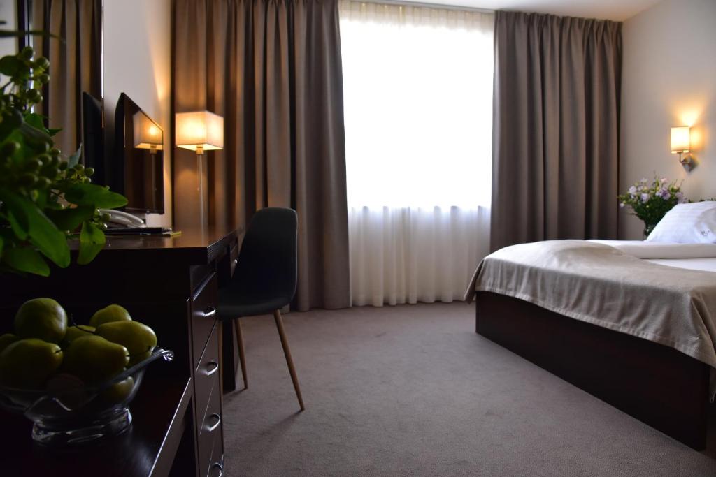 Postel nebo postele na pokoji v ubytování Hotel Hi-Fi Spa