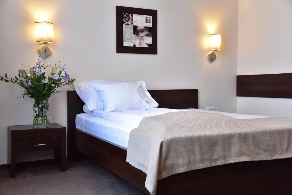 Postel nebo postele na pokoji v ubytování Hotel Hi-Fi Spa