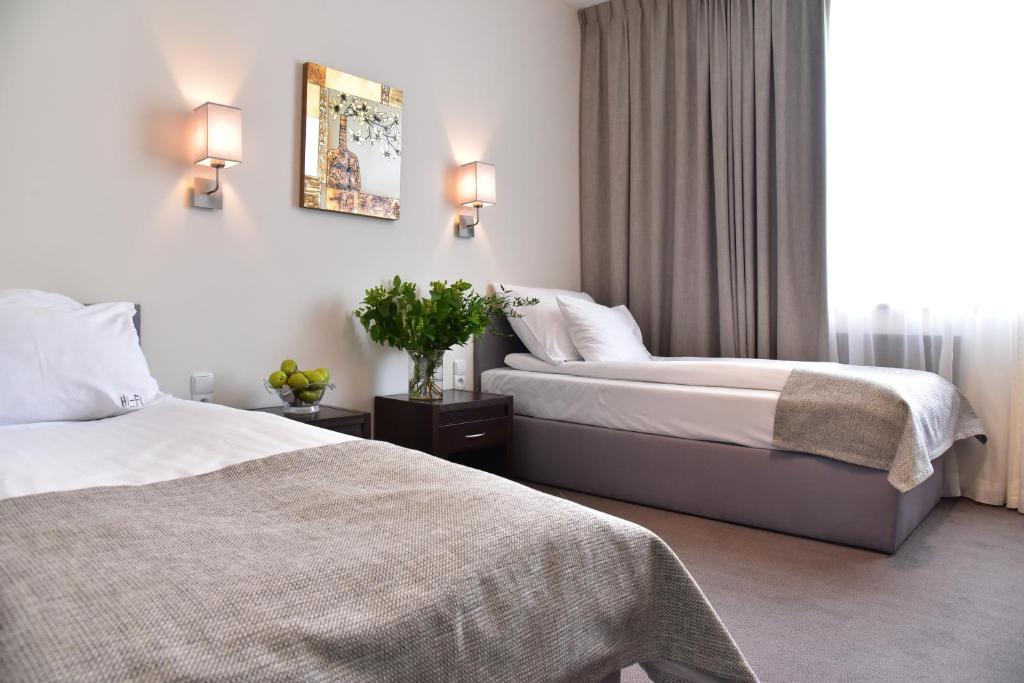 Postel nebo postele na pokoji v ubytování Hotel Hi-Fi Spa