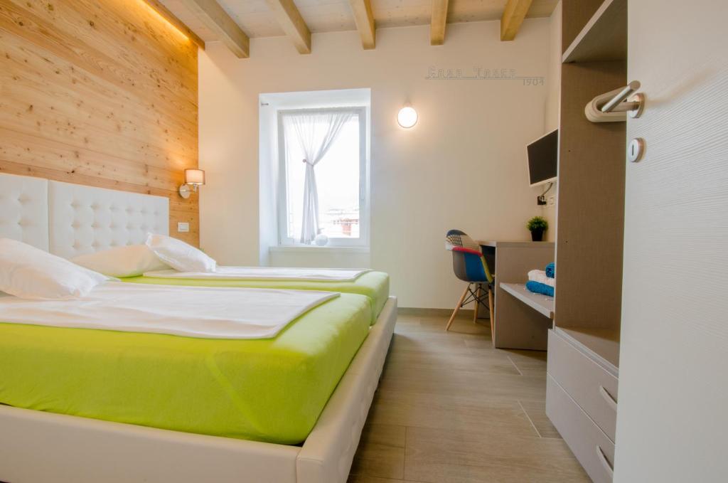 Łóżko lub łóżka w pokoju w obiekcie Casa Tosca - Holiday Home