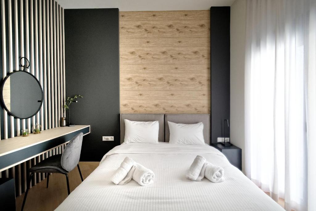 Posteľ alebo postele v izbe v ubytovaní Muses Residence
