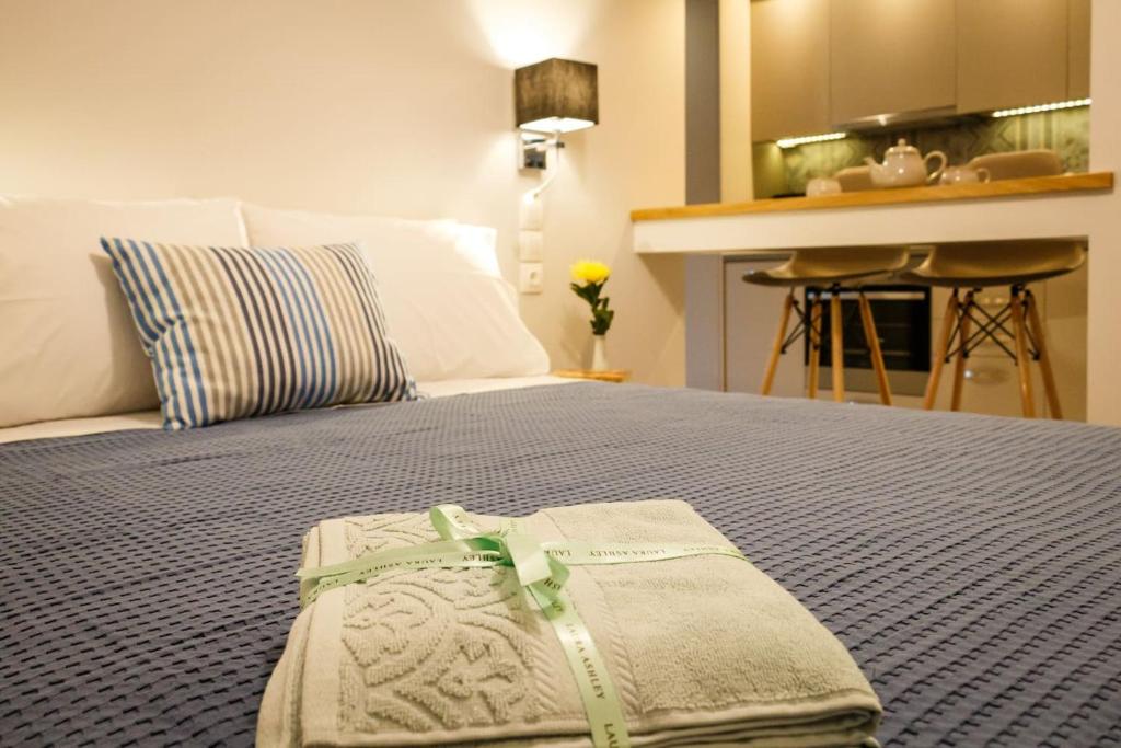 A bed or beds in a room at Plession Apartment