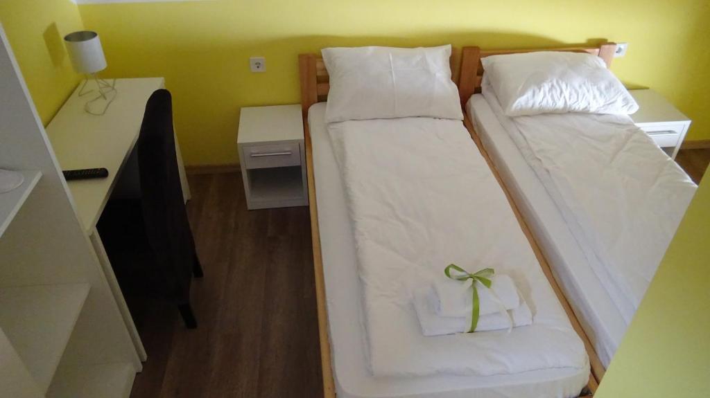 Postel nebo postele na pokoji v ubytování Apartmani Bojeresku Negotin