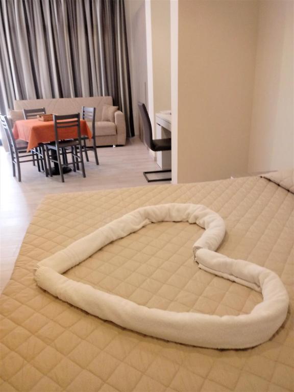 Postel nebo postele na pokoji v ubytování HOTEL DOZZA