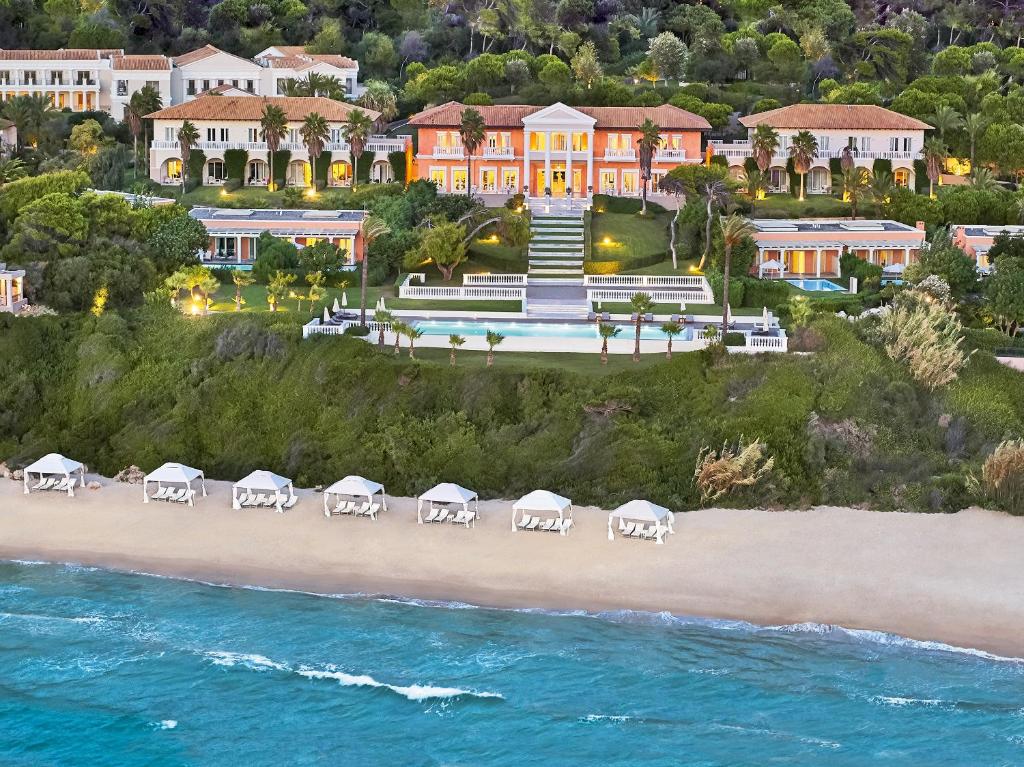 an aerial view of a resort on the beach at Mandola Rosa Grecotel Boutique Resort in Loutra Killinis
