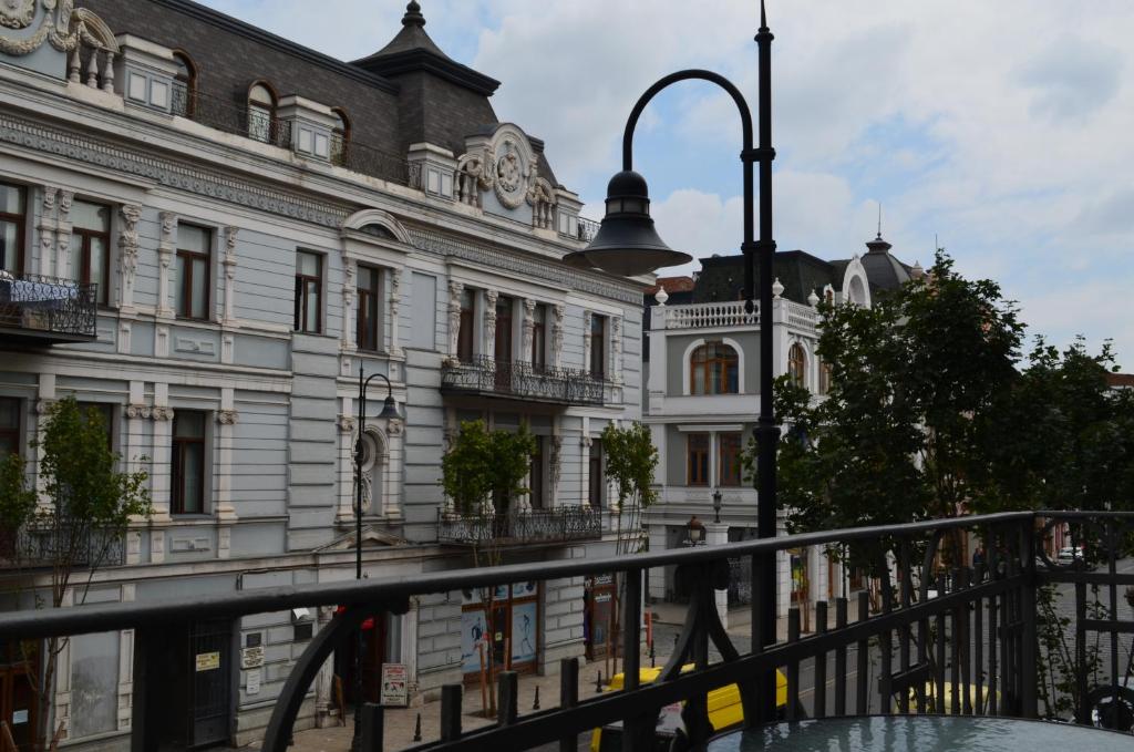 a building with a street light in front of it at Sweet Home Agmashenebeli in Tbilisi City