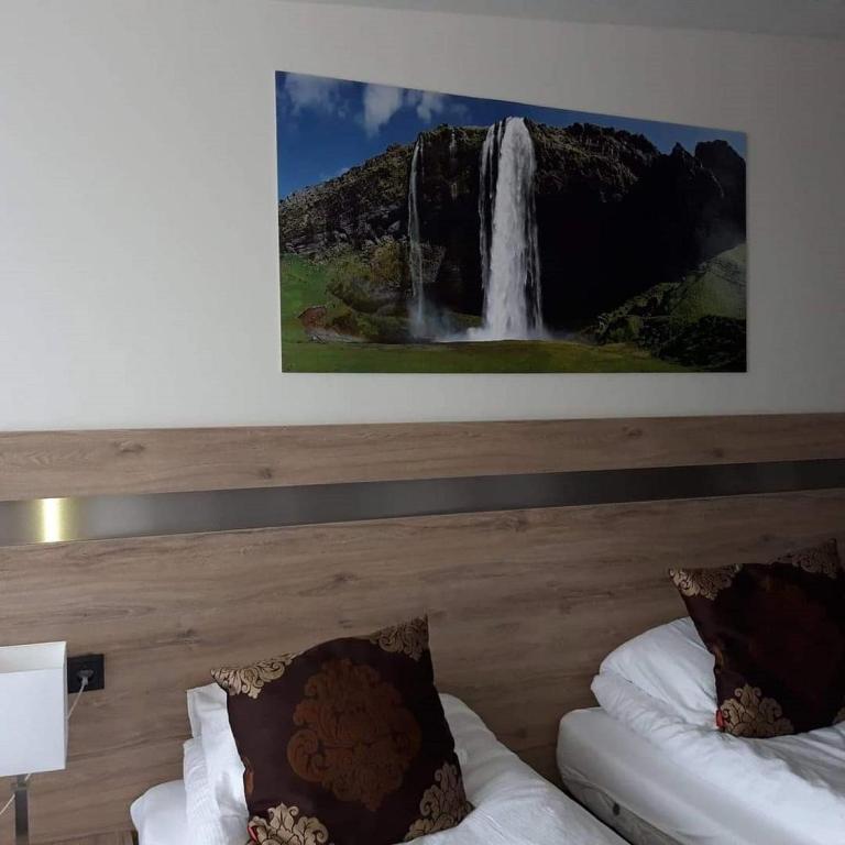 Postel nebo postele na pokoji v ubytování Hotel Duus by Keflavik Airport